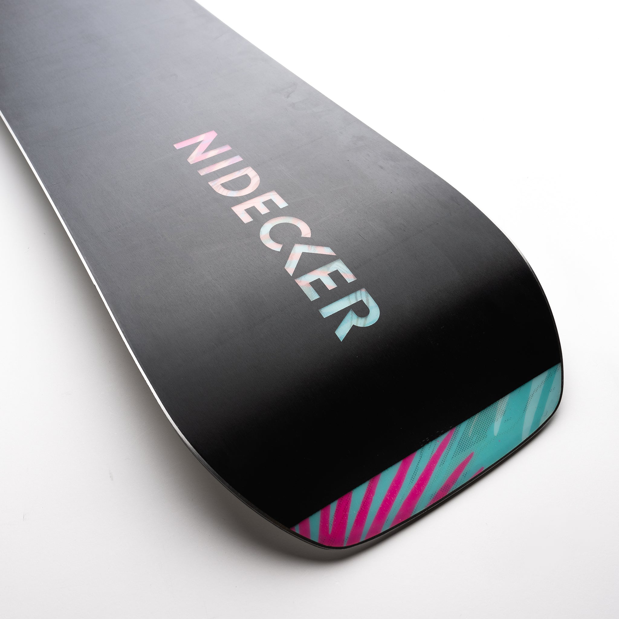 Nidecker Venus Women's Snowboard 2025 - A black snowboard with a pink and blue patterned design at the tip.