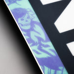 Nidecker Sensor Women's Snowboard 2025 - A snowboard with a purple and green graphic of a woman skiing on it.