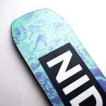 Nidecker Sensor Women's Snowboard 2025 - A light blue snowboard with a pattern of purple silhouettes of women in various poses, including skiing and snowboarding.