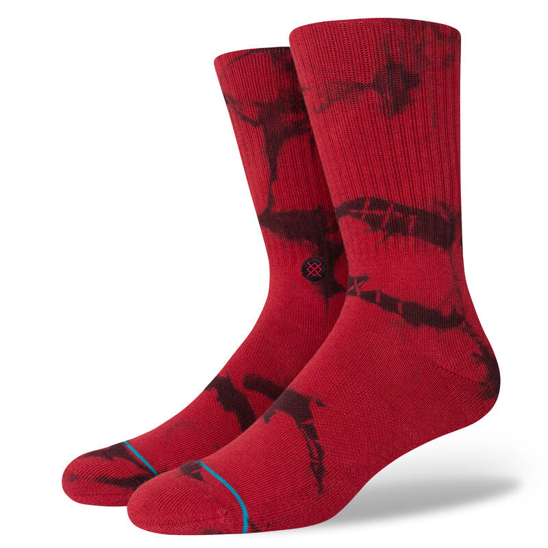 NOsten CREW C Sock - A pair of red crew socks with a black logo on the top and blue lines at the toes.