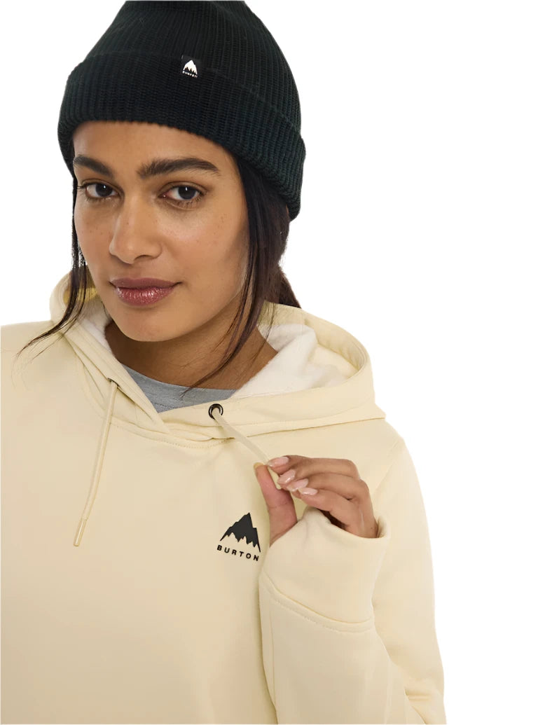 Burton Women's Oak Pullover Hoodie 2025 - A cream-colored hoodie with a black logo featuring a mountain peak and the word "BURTON" in small letters.
