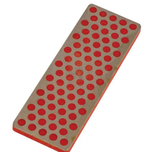 Oneball Diamond Stone Fine 2025 - A rectangular, gray stone with a flat top and rounded edges, featuring numerous small red dots arranged in rows across its surface.