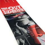 CAPiTA The Outsiders Snowboard 2025 - A red snowboard with a black and white graphic of a man's face wearing sunglasses, overlaid with orange flames.
