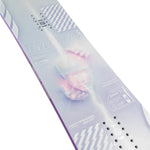 CAPiTA Pathfinder Camber Snowboard 2025 - A snowboard with a light blue background and white diagonal stripes, featuring a large pink heart graphic in the center.