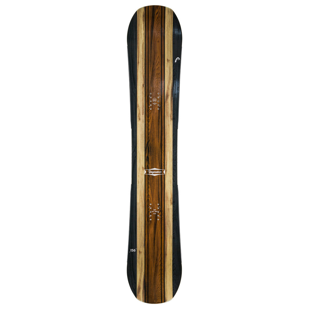 Head Daymaker Snowboard 2025 - A brown snowboard with a white logo on top and a black stripe at the bottom.