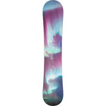 Head Women's Stella Snowboard 2025 - A snowboard with a pink and white design, featuring a woman riding it in the background.