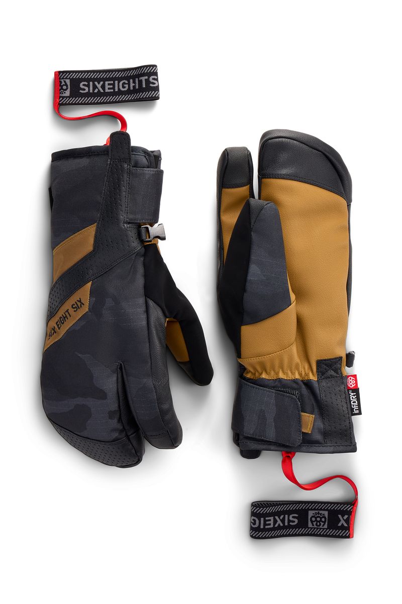 Black camo ski trigger mitts with tan palm and wrist strap, padded knuckle panel
