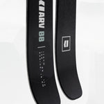 Black skis close-up with Armada ARV 88 branding and markings