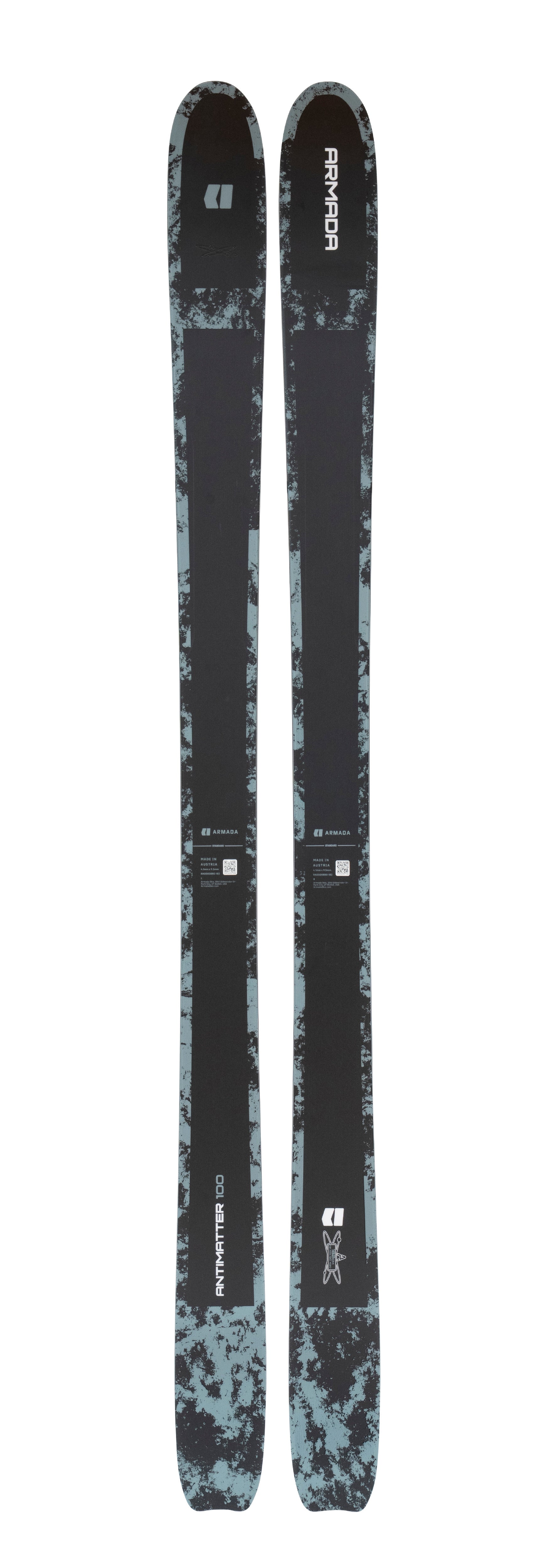 Armada ski pair with dark camo topsheet and 'PRIMORDIAL' text on both skis