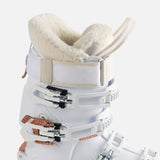 Rossignol Women's Vizion Pro 100 Ski Boots 2023 - A white ski boot with a rose gold buckle and strap, featuring a textured pattern on the side.
