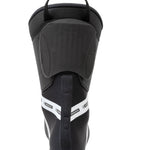 Black ski boot heel and rear opening with padded collar and top pull strap