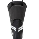 Black ski boot heel and rear opening with padded collar and top pull strap