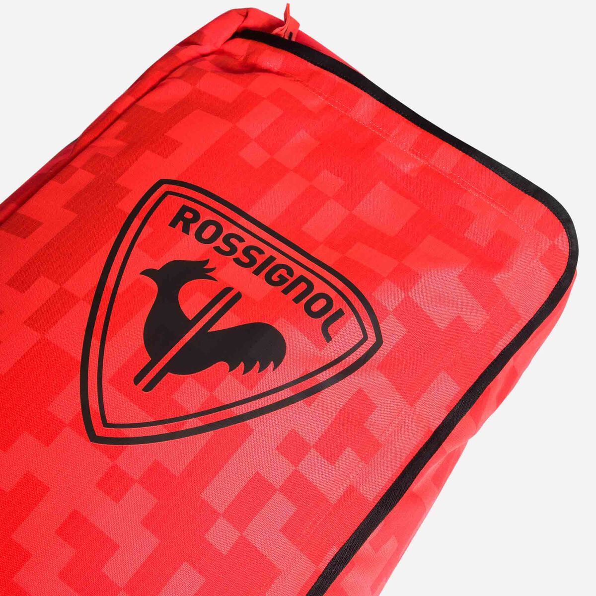 Rossignol Hero Ski 2/3 Pair Ski Bag 2023 - A red ski bag with a black zipper and a logo featuring a rooster in front of a shield.