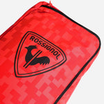 Rossignol Hero Ski 2/3 Pair Ski Bag 2023 - A red ski bag with a black zipper and a logo featuring a rooster in front of a shield.