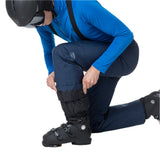 Rossignol Men's Insulated Ski Pant - A pair of navy blue ski pants with a zippered pocket on the thigh and a logo patch near the left knee.