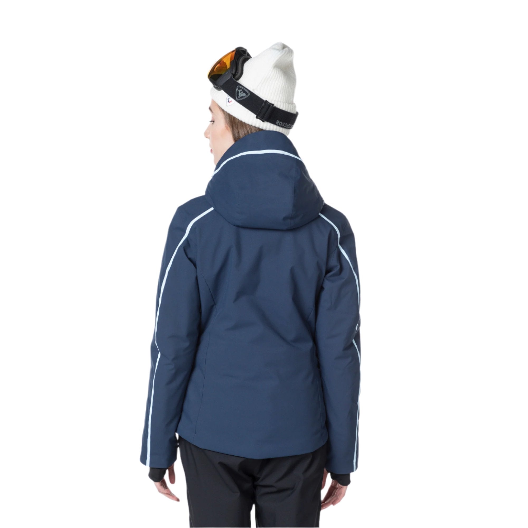 Rossignol Women's Flat Insulated Jacket 2025 - A navy blue jacket with white stripes on the sleeves and a hood, worn by a model from behind.