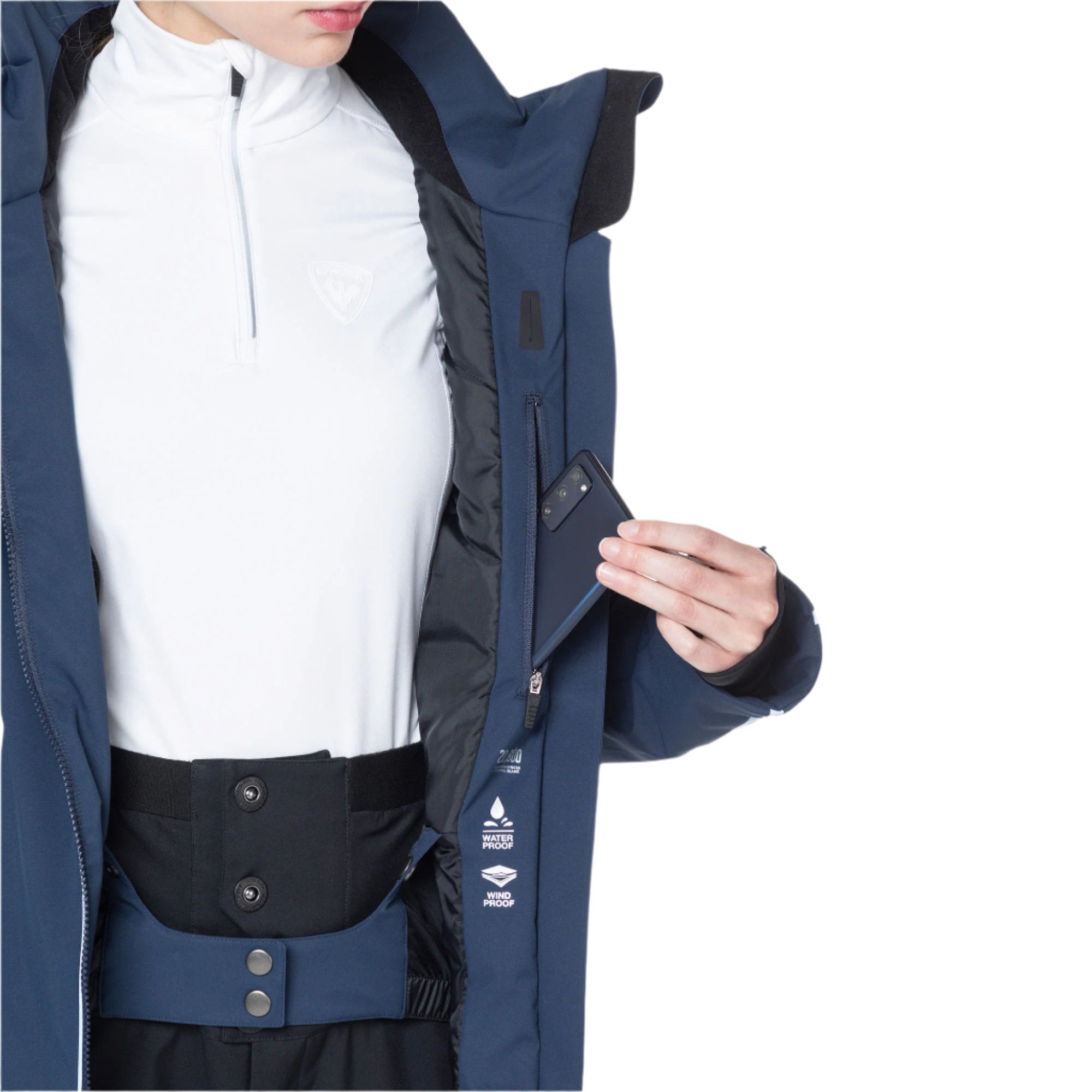 Rossignol Women's Flat Insulated Jacket 2025 - A navy blue jacket with a white logo on the chest and two zippered pockets at the waist.