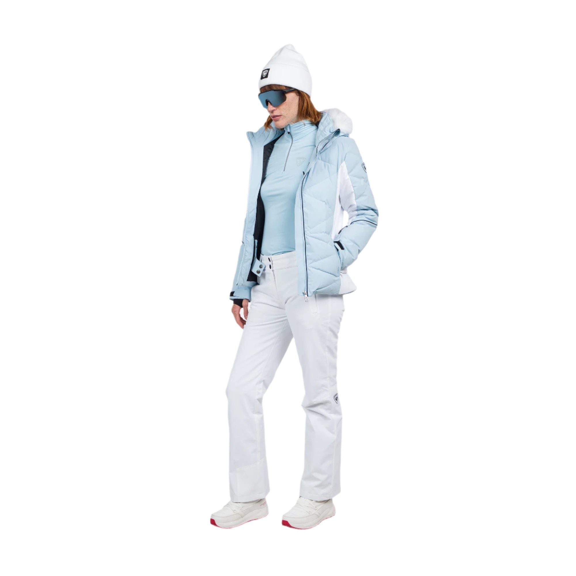 Rossignol Women's Staci Insulated Pant 2025 - A light blue ski pant with a white stripe down the side and black accents on the pockets.