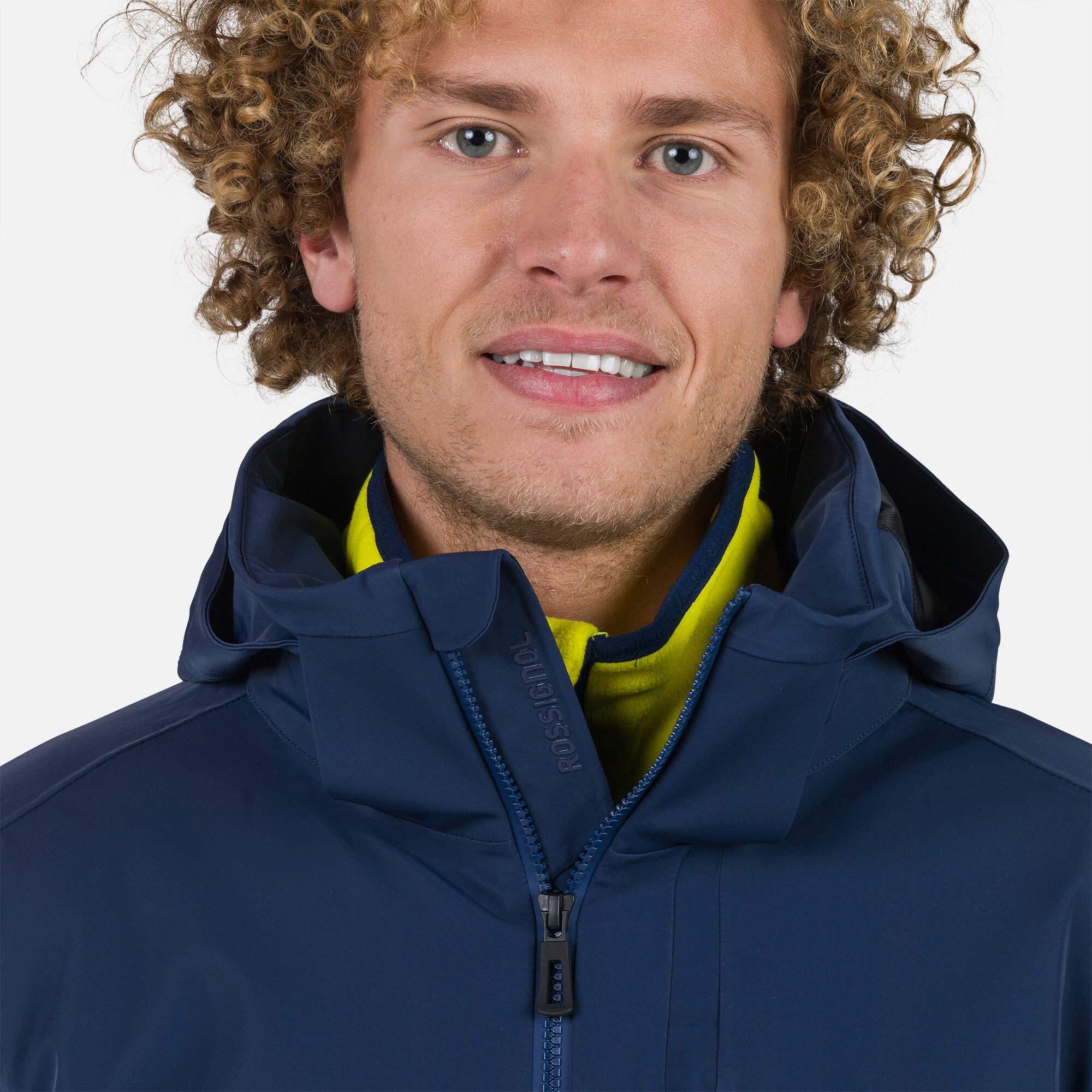 Rossignol Men's Blackside Insulated Jacket - A black insulated jacket with a high collar and zippered pockets.