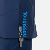 Rossignol Men's Blackside Insulated Jacket - A black jacket with a zippered chest pocket and two zippered side pockets, featuring a Rossignol logo on the left sleeve.