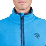 Rossignol Men's Strawpile 1/2 Zip Fleece Top - A light blue fleece top with a zipper down the front and a logo on the left chest.