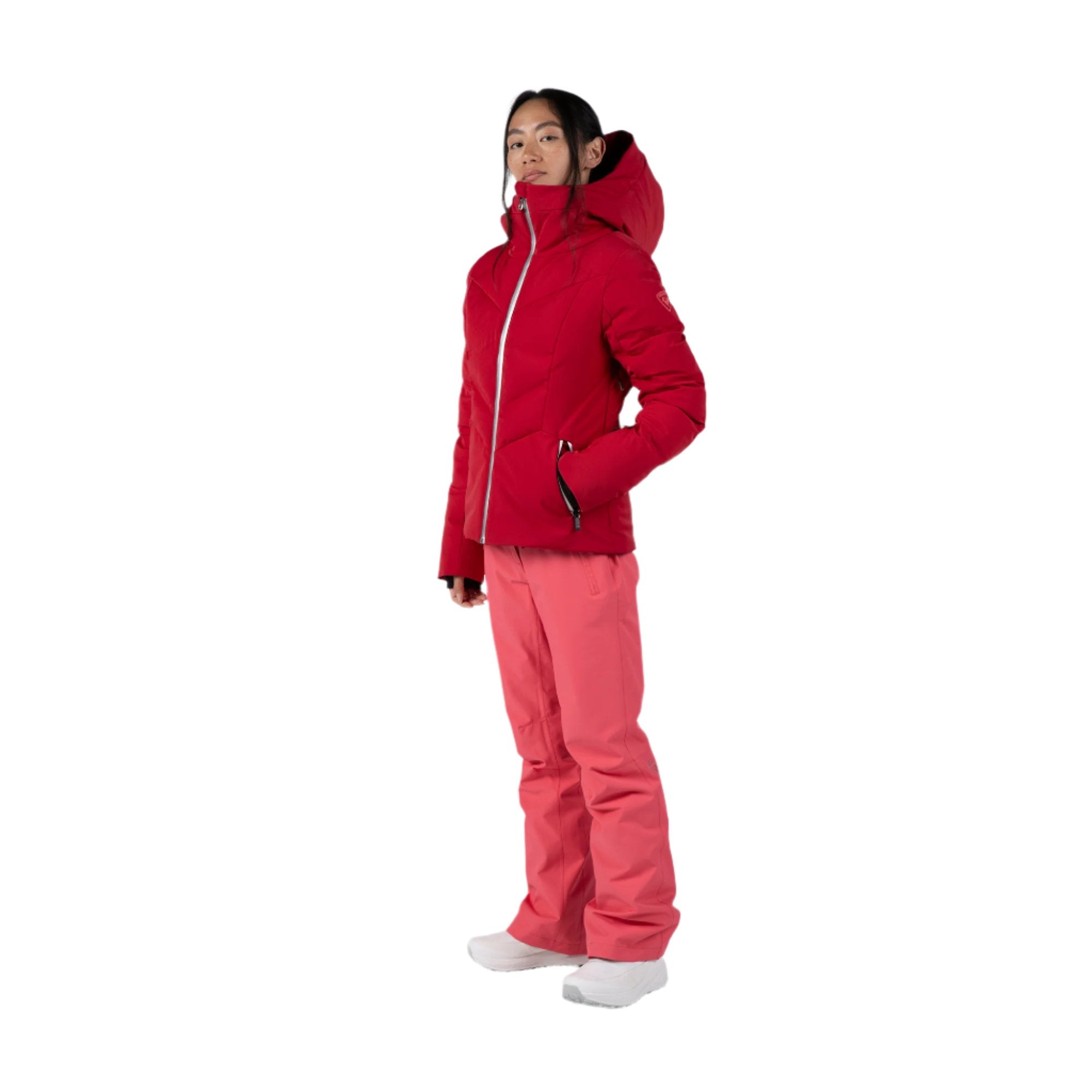 Rossignol Women's Blackside Puffy Jacket - A black puffy jacket with a high collar and zippered pockets.