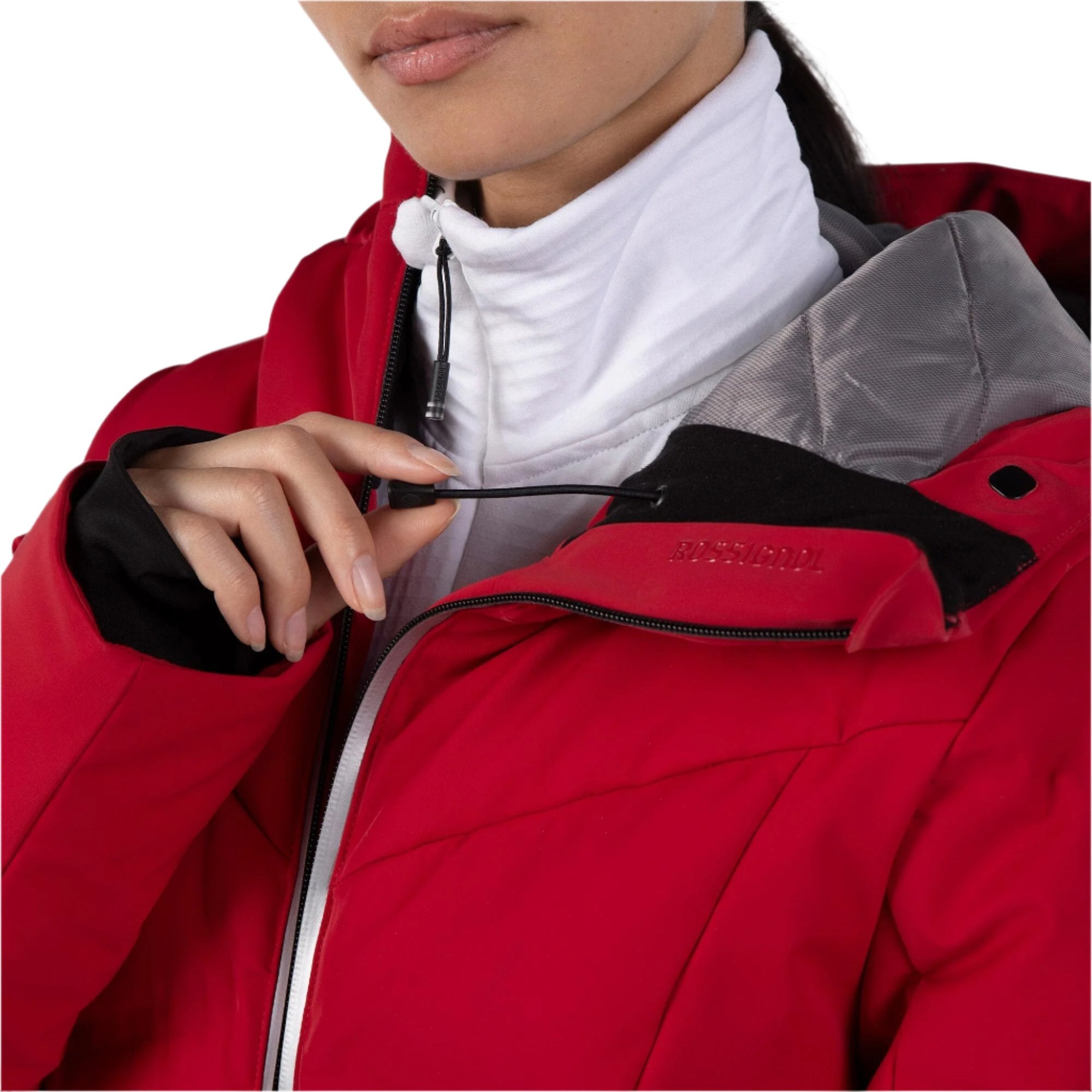 Rossignol Women's Blackside Puffy Jacket - A black puffy jacket with a hood, featuring a zippered front and two pockets on either side.