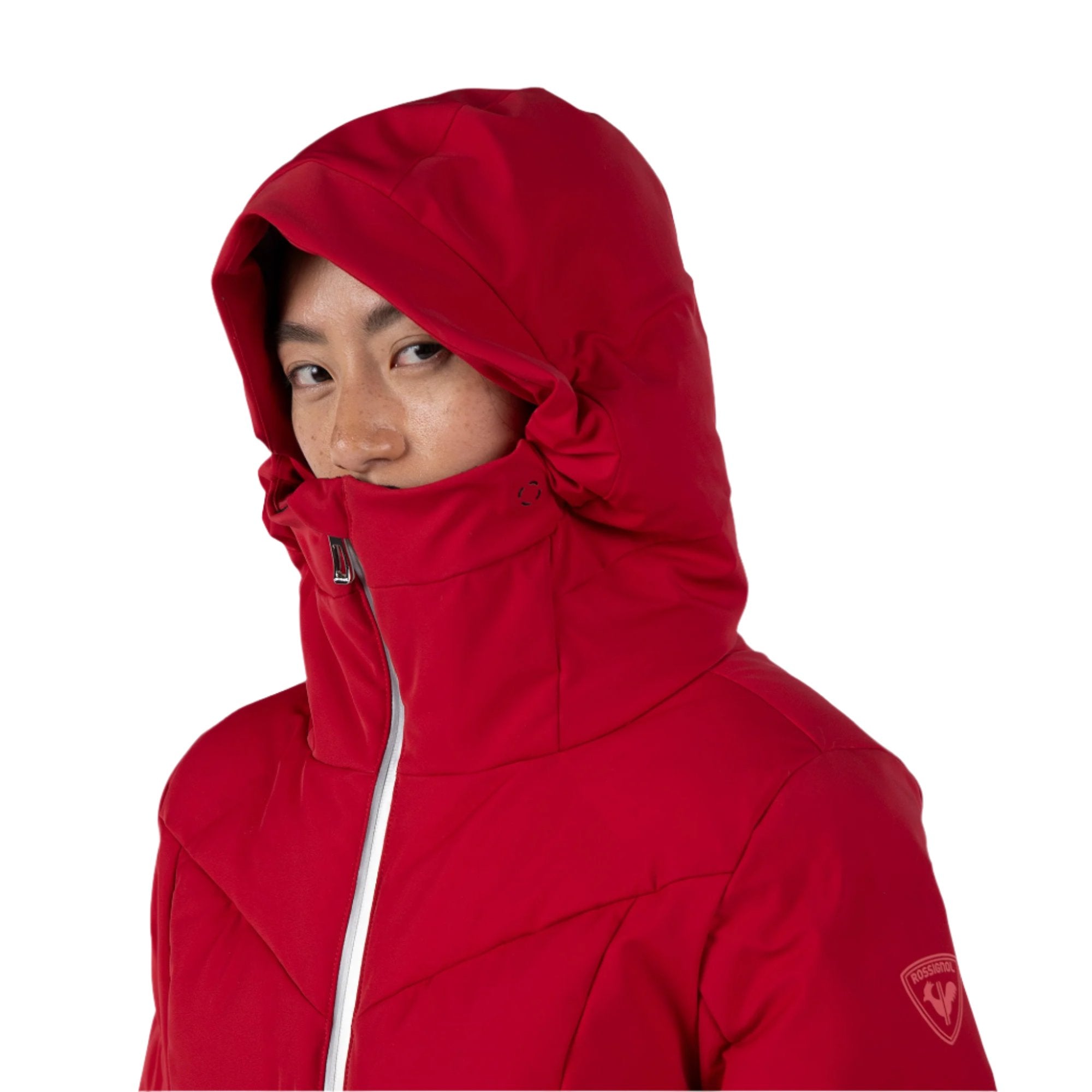 Rossignol Women's Blackside Puffy Jacket - A black puffy jacket with a hood, featuring a zipper down the front and two zippered pockets on either side.