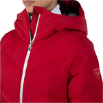 Rossignol Women's Blackside Puffy Jacket - A black puffy jacket with a hood, featuring a zipper down the front and two pockets on either side.
