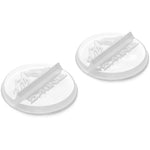 Dakine Round Scraper Stomps 2pc 2025 - Two round, clear plastic scraper stomp pads with a wavy design on top and a flat bottom.