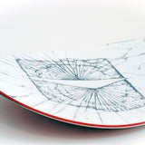 White snowboard with blue line-map graphic and red edge stripe.