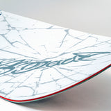 White snowboard with blue signature-style graphic and red sidewall line.