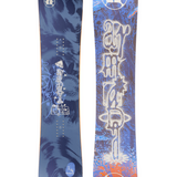 Pair of blue snowboards with white logos, tie-dye graphics, and orange accents