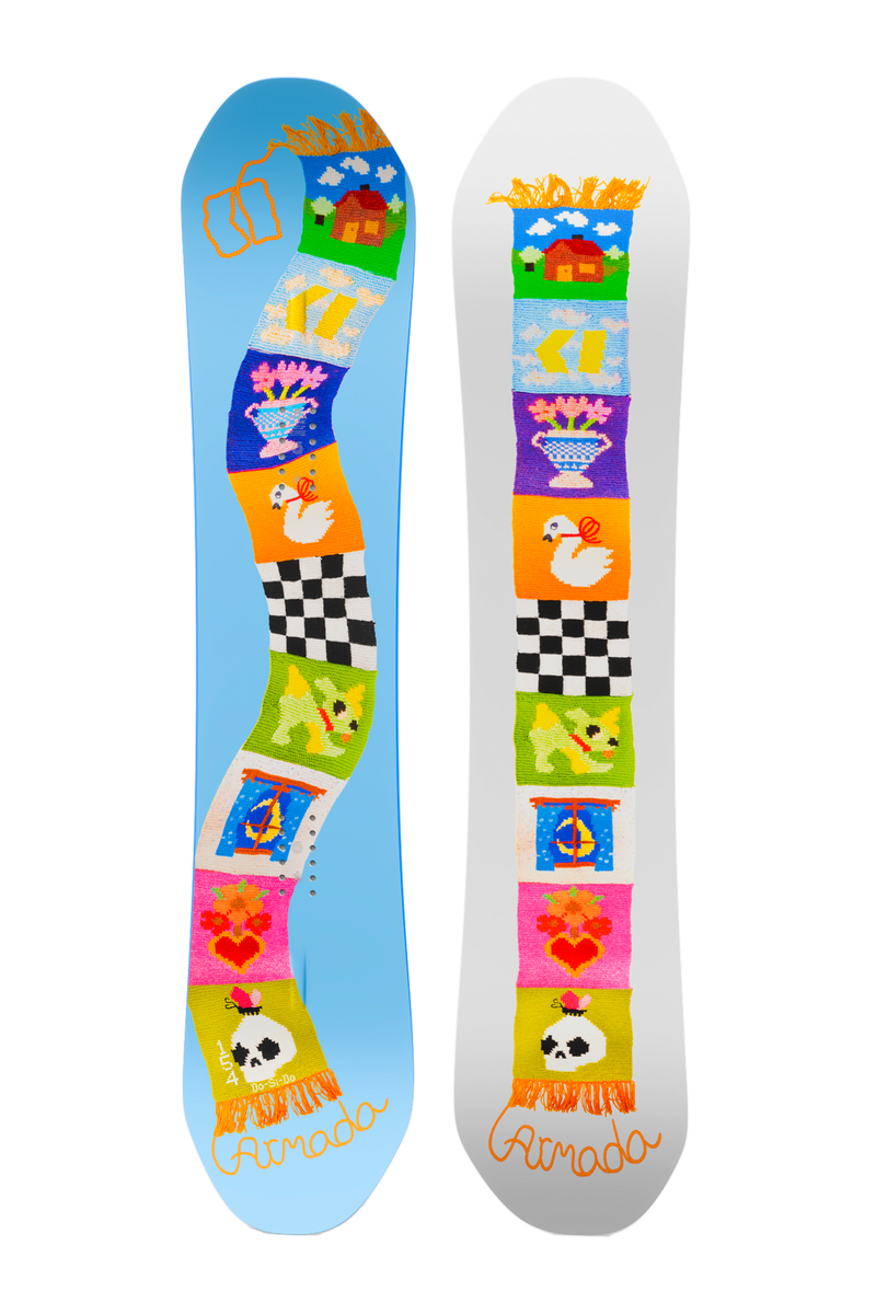Pair of light blue snowboards with colorful character graphics and black checker patterns