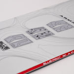 White snowboard top deck with blueprint graphics and red "BLUEPRINT" band