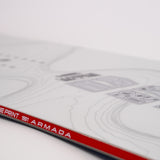White snowboard close-up with Blueprint 1|1 Armada text and red/black rail