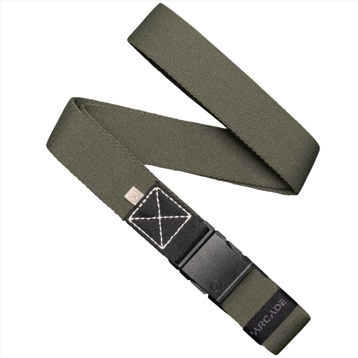 An ivy green fabric belt with a black rectangular patch near the buckle, folded in a crisscross pattern. The belt features a rectangular plastic buckle, and the word 'ARCADE' is visible near the end.