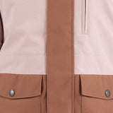 Airblaster Women's Stay Wild Insulated Jacket 2025 - A light pink jacket with a zippered chest pocket and two front pockets, featuring a subtle pattern of darker pink lines on the upper back.