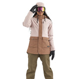 Airblaster Women's Stay Wild Insulated Jacket 2025 - A woman wearing a pink and brown jacket with two front pockets, black gloves, and goggles.