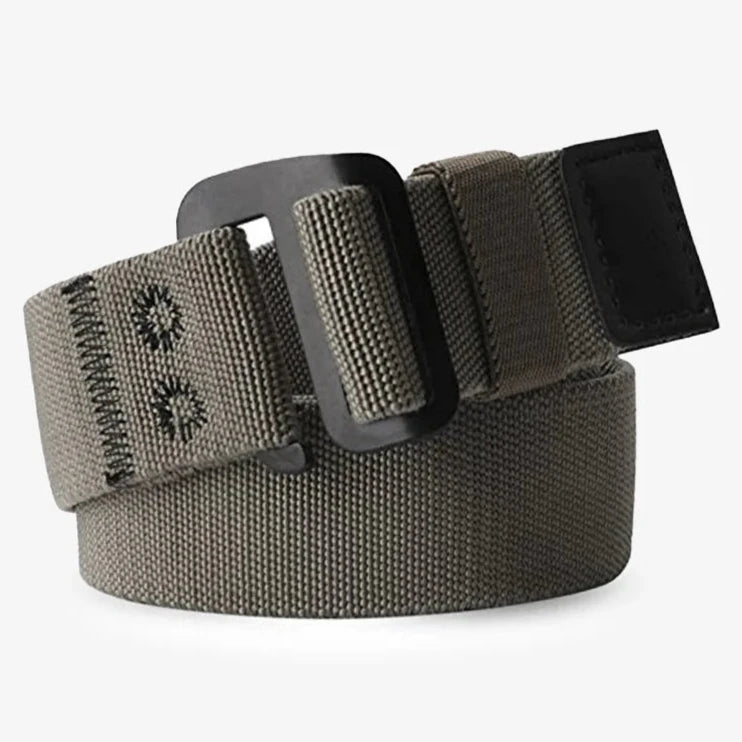 FIELD BELT - A khaki-colored belt with a woven pattern, featuring a black buckle and a rectangular tag on the end.