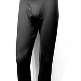 Treviso Tek Poly Base Layer 2022 - Bottom - A pair of black base layer bottoms with a white logo on the waistband.