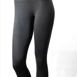 Treviso Women's Tek Poly Base Layer 2022 - Bottom - The leggings are dark gray with a subtle sheen, featuring a high waistband and a seamless crotch area.