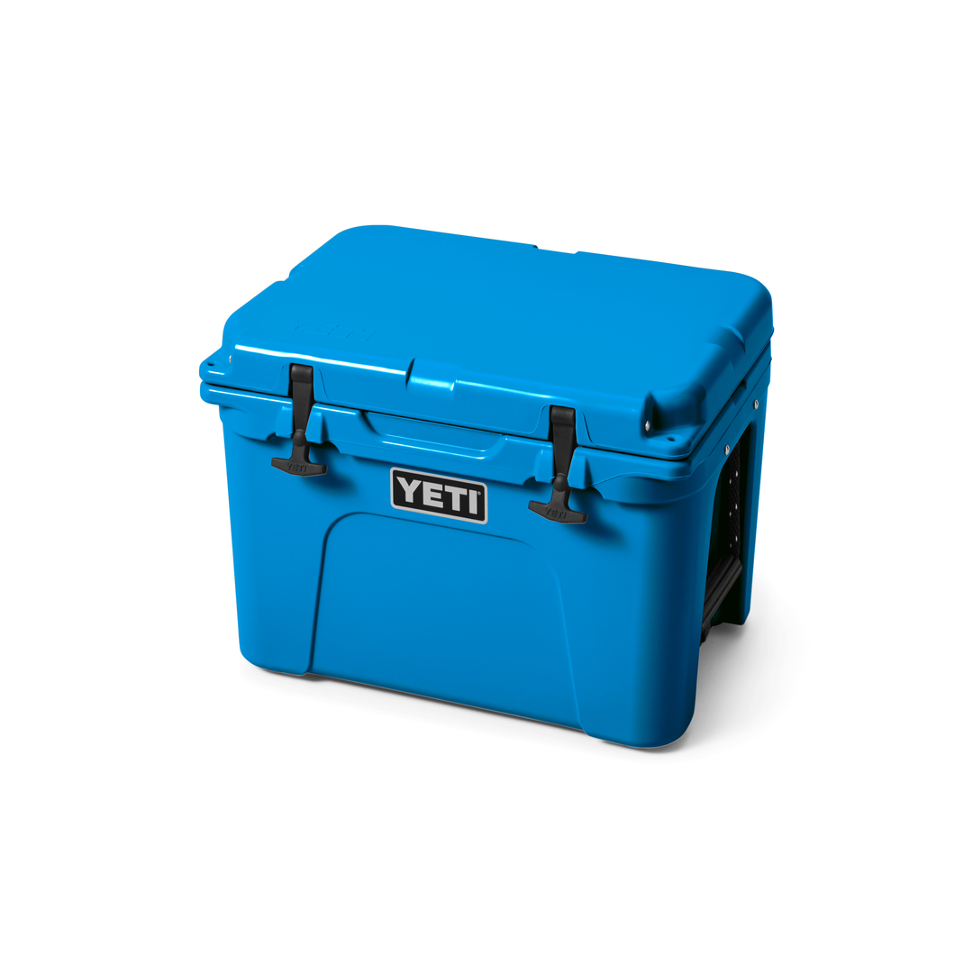 Yeti Tundra 35 Hard Cooler - A large, rectangular cooler with a dark gray lid and matching body, featuring a handle on top and a logo in silver letters on the front.