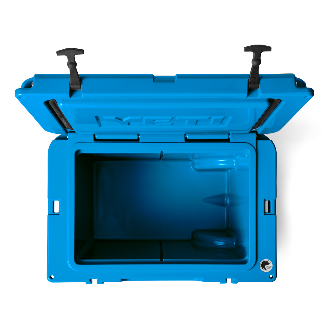Yeti Tundra 35 Hard Cooler - A blue cooler with a handle on top and two latches on the front.