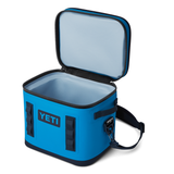 Yeti Hopper Flip 12 Personal Cooler - A blue cooler with a zipper closure and two handles on either side, featuring a black logo that reads "YETI" in bold letters.