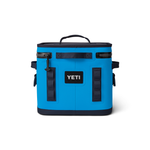 Yeti Hopper Flip 12 Personal Cooler - A blue cooler with a handle on top and two zipper compartments, one of which is open to reveal an ice pack inside.
