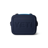 Yeti Hopper Flip 12 Personal Cooler - A navy blue cooler with a handle on top and a zipper closure.