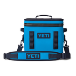 Yeti Hopper Flip 12 Personal Cooler - A blue cooler with a handle on top and two side handles, featuring a zipper closure.