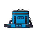 Yeti Hopper Flip 8 Personal Cooler - A blue cooler with a handle on top and two side handles, featuring a zipper closure.