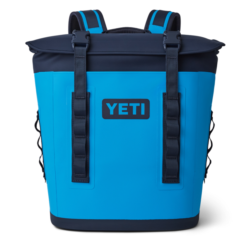 Yeti Hopper M12 Backpack Soft Cooler - A large, blue backpack-style cooler with a zippered top and two adjustable shoulder straps.